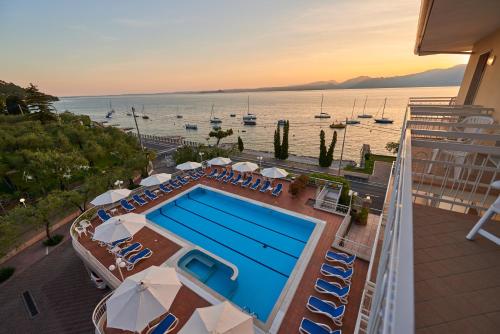 an aerial view of a swimming pool on a cruise ship at Hotel Benacus Torri del Benaco in Torri del Benaco