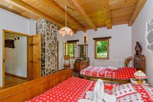 Postel nebo postele na pokoji v ubytování Holiday House Sobol