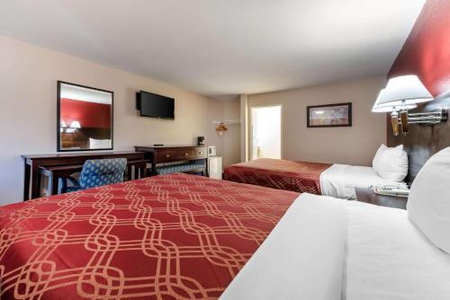 Ένα ή περισσότερα κρεβάτια σε δωμάτιο στο Bay Breeze Inn
