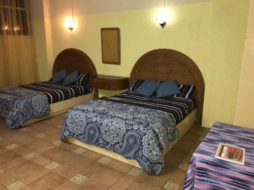 Ліжко або ліжка в номері Grand Bay Beach Tourist Residence Mauritius