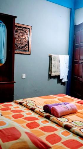 Postel nebo postele na pokoji v ubytování Homestay Petrajaya Kuching