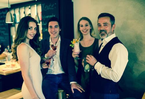a group of people posing for a picture at IMbery Hotel & Restaurant Hinterzarten in Hinterzarten