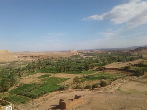 an aerial view of a valley in the desert at Kasbah tifaoute ait Ben haddou in Aït Ben Haddou