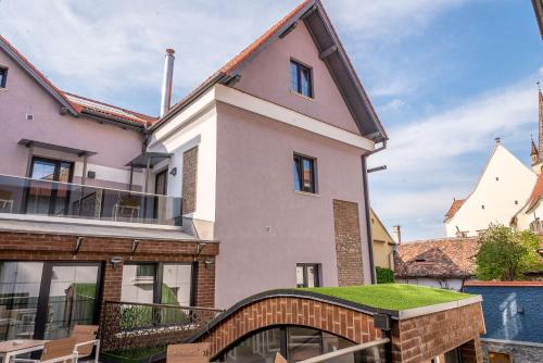 an image of a house with a balcony at ART Hotel in Sibiu