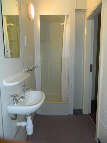 a bathroom with a sink and a shower at Andrew Stewart Hall in Stirling