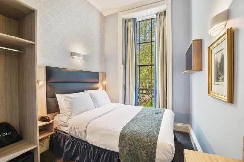 Säng eller sängar i ett rum på The Judd Hotel