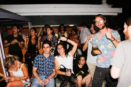a group of people standing around in a crowd at Hostel Boutique Merced 88 in Santiago
