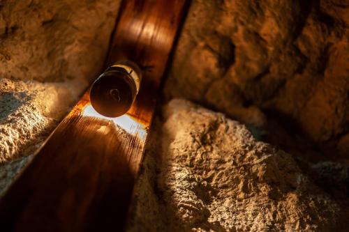 a close up of a wooden door with some rocks at Ruhr Inn Hotel in Hattingen