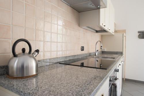 A kitchen or kitchenette at Luisella Apartments