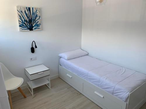 Postel nebo postele na pokoji v ubytování Teiga Playa