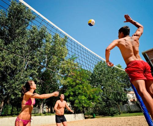 a group of people playing a game of volleyball at Sol Nessebar Mare All Inclusive in Nesebar