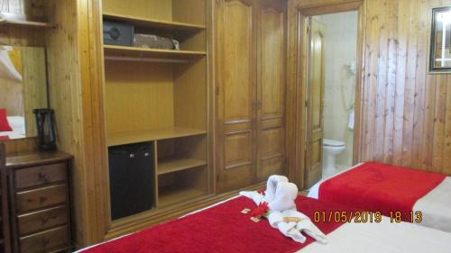 Ένα ή περισσότερα κρεβάτια σε δωμάτιο στο Hotel Playa Samil Vigo