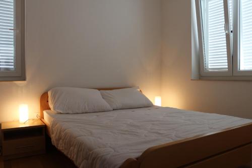 Postel nebo postele na pokoji v ubytování Apartment Zoranica Novalja