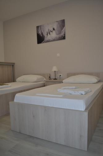 two beds in a room with at Skunca’s house in Novalja
