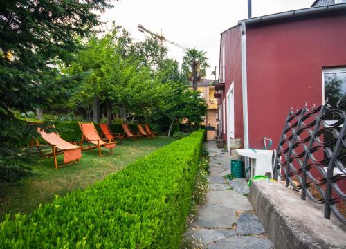a row of chairs in a yard next to a building at CASA PELTRE in Sarria
