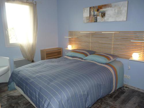 Postel nebo postele na pokoji v ubytování Gîte Les Vignes