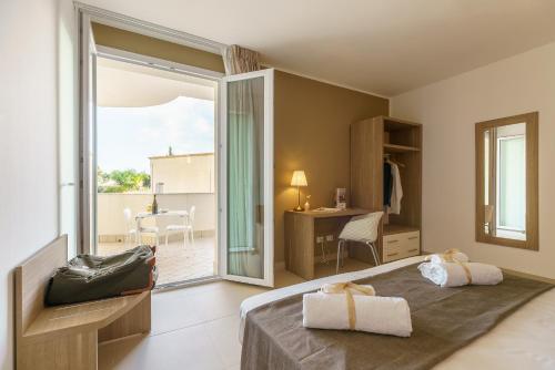 Posteľ alebo postele v izbe v ubytovaní Travini Hotel Residence