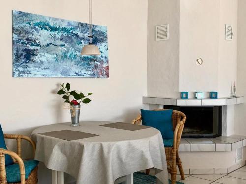 a kitchen with a table with a vase on it at Casa Vista Lago in Minusio