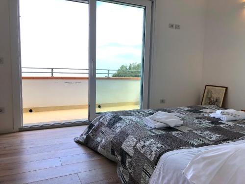 En eller flere senge i et værelse på Country House Tagliaferro