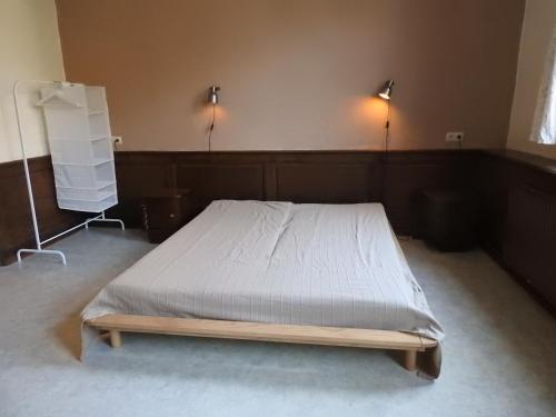 Кровать или кровати в номере LA DILIGENCE