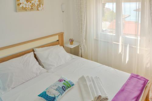 Postel nebo postele na pokoji v ubytování Apartment Kata