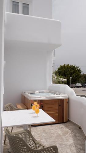 a kitchen with a table and two chairs at Spiros in Naxos Chora