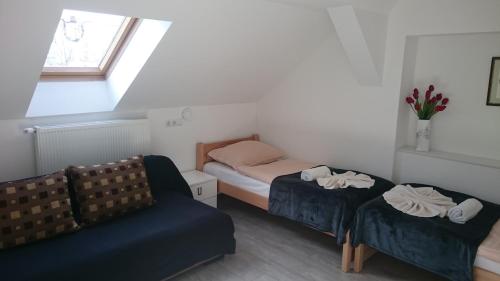 Posteľ alebo postele v izbe v ubytovaní Guest House Villa Herbarium