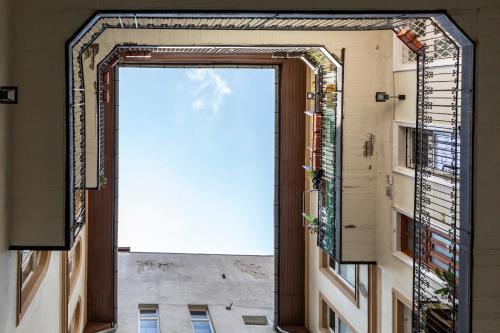 an open door to a building with a view at Vintage Home in the Center in Budapest