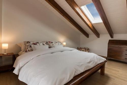 En eller flere senge i et værelse på Villa 'Nduccia