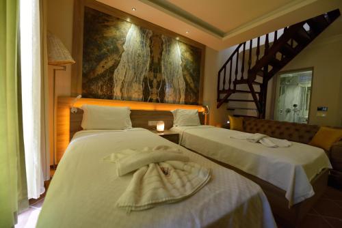 Tempat tidur dalam kamar di Seyir Beach Hotel