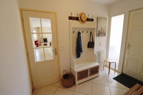 a hallway with a door and a coat rack at La Cèzenole in Méjannes-le-Clap