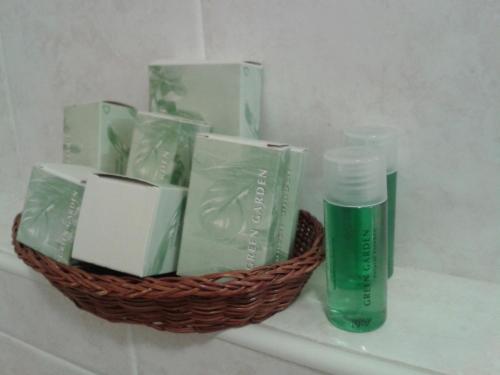 a basket of soap and a bottle on a shelf at Hotel Garden Ristorante in Tabiano