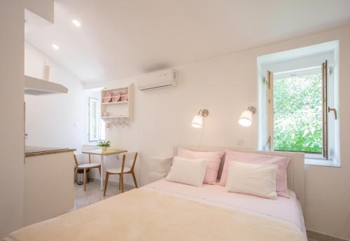 Postel nebo postele na pokoji v ubytování Apartment in Vis historic center - Mikula, Ljubica, Toma