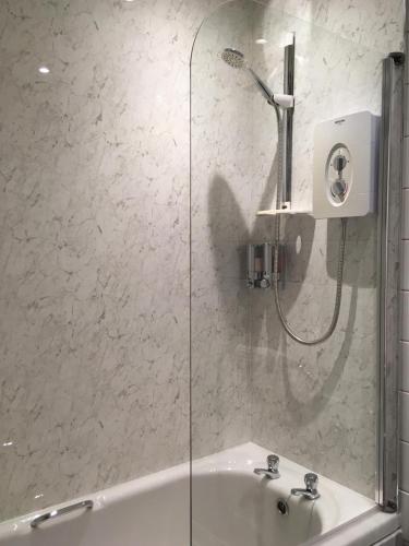 a bathroom with a shower and a sink at NUMBER 7 in Kyleakin