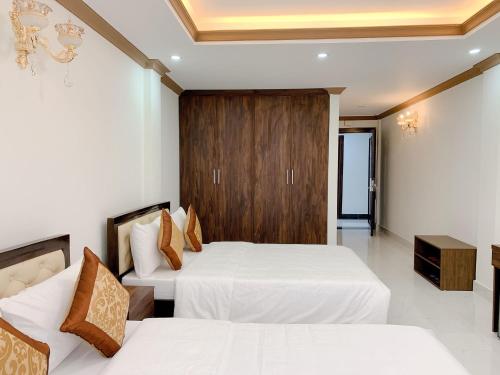 Ліжко або ліжка в номері Dat Anh Hotel
