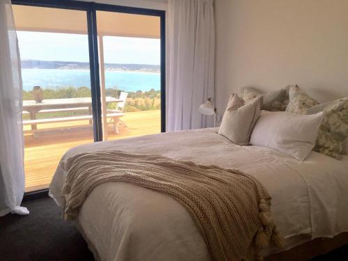 Säng eller sängar i ett rum på The Cape