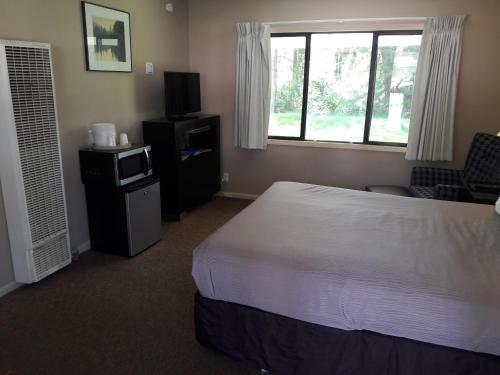 Postel nebo postele na pokoji v ubytování Monroe Motel