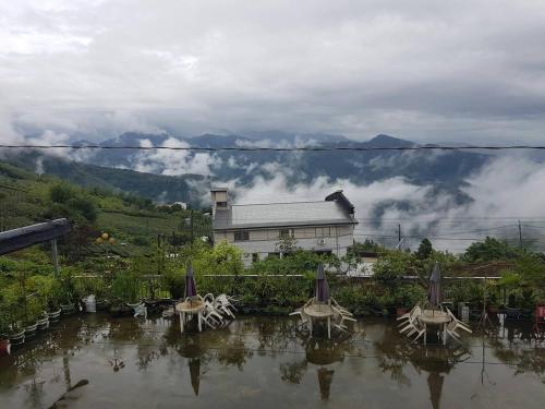 a house in the middle of a flooded street at Ming Yang B&B in Fenchihu