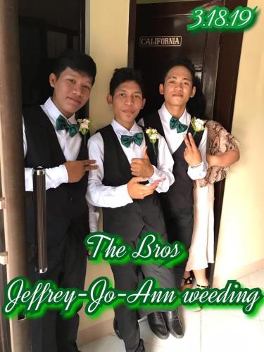 three men dressed in tuxedos and bow ties posing for a picture at Lei Kendee in Digos