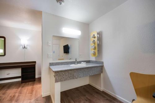 a bathroom with a sink and a mirror at Motel 6-Burlington, WA in Burlington