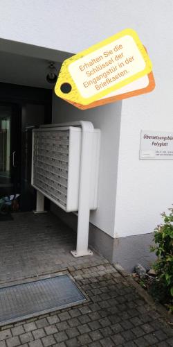 a sign on the side of a building at Sroom 118 and 119 in Center in Reutlingen