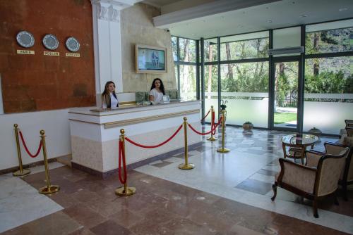 two women sitting at a counter in a room at Arzni Health Resort in Arzni