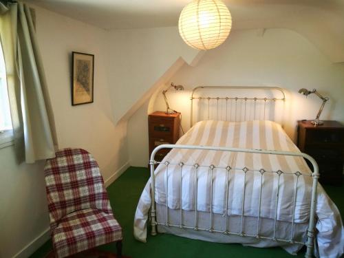 Ένα ή περισσότερα κρεβάτια σε δωμάτιο στο Gîte d'Aigues Vives