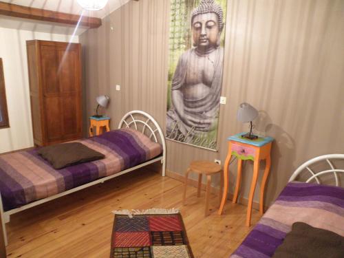 En eller flere senge i et værelse på Les Cigales