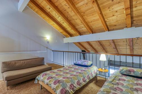 a bedroom with a bed and a couch in a room at 2 Bed 2 Bath Apartment in Carnelian Bay in Carnelian Bay