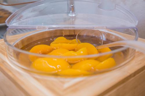 a plastic container filled with yellow food in at Hotel Prestige in Montesilvano