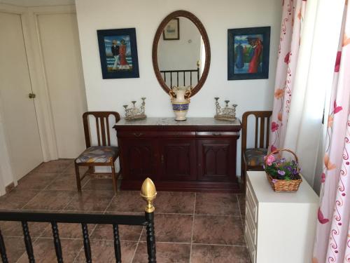a dressing room with a mirror and a table at Finca La Rosalía in Setenil