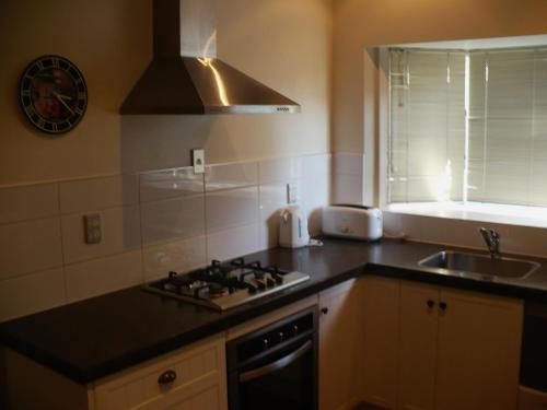 Køkken eller tekøkken på Clarence Cottage