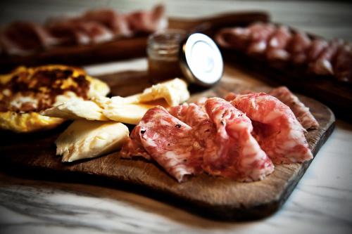 a cutting board with shrimp and other foods on it at Casa della Fornace in San Vito al Torre