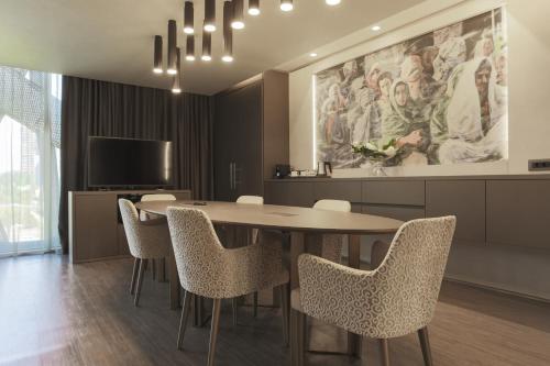 a dining room with a table and chairs at The Legacy Luxury Hotel, Algiers in Alger